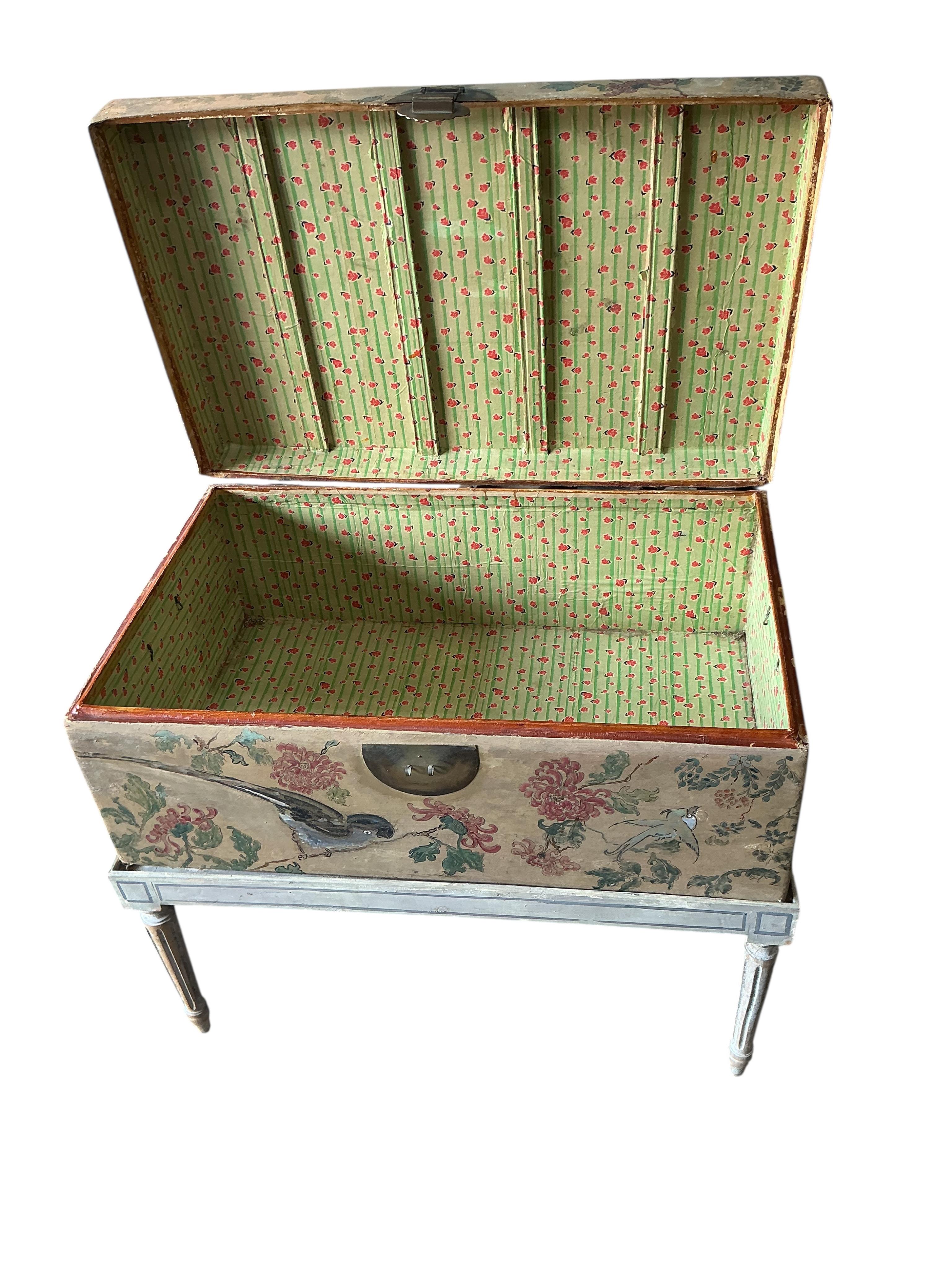 A Chinese painted hide chest on a cream painted parcel gilt stand, width 77cm, depth 50cm, height 67cm